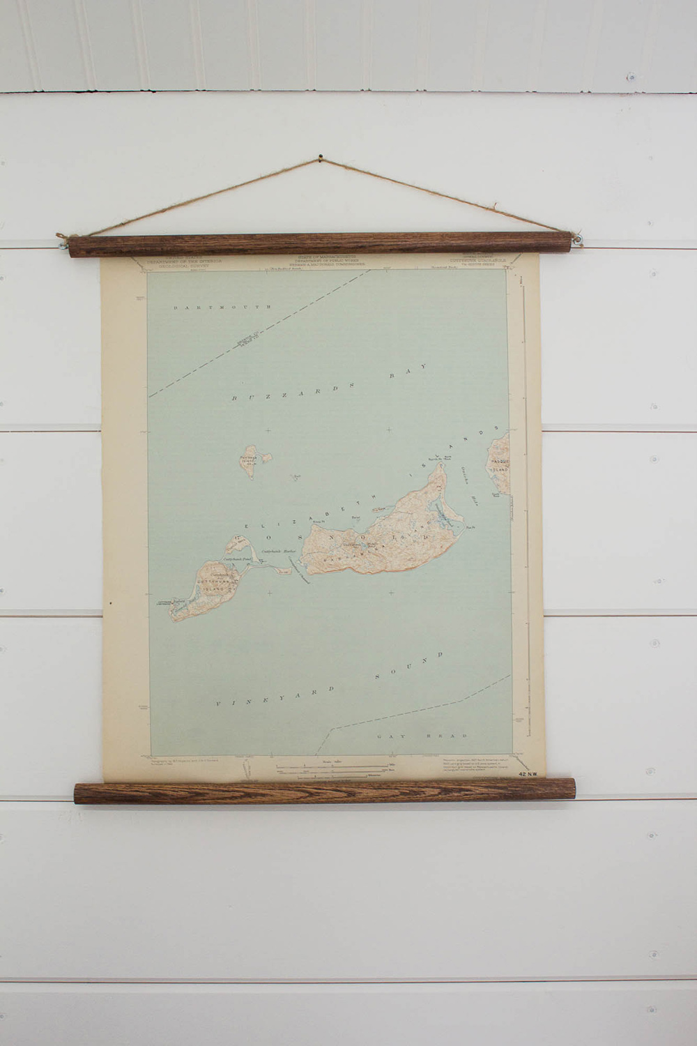 White shiplap wall with a map. White shiplap wall with a map.