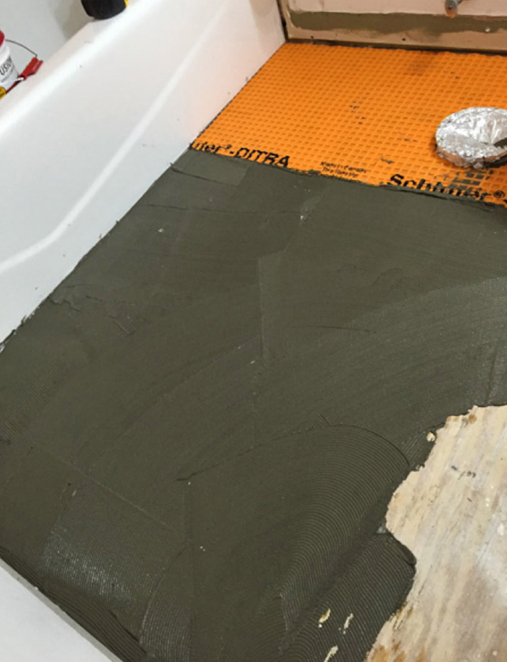Colored Grout and New Tile Create Fresh Bathroom Look