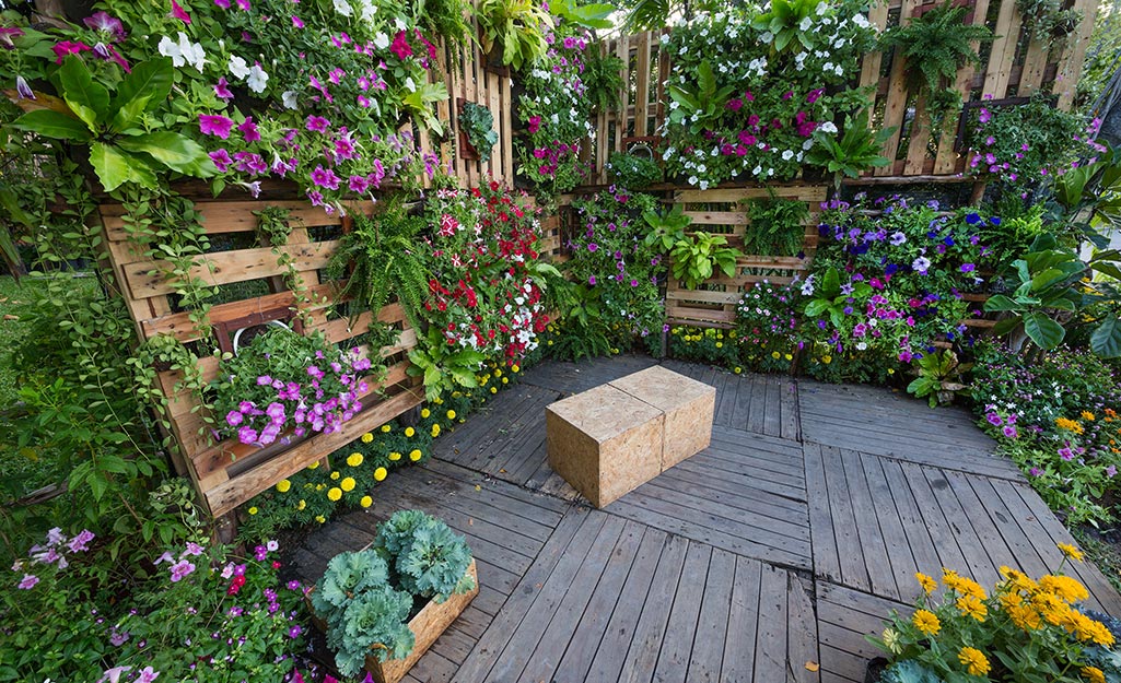 A patio with vertical wall gardens