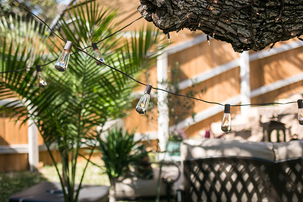 A set of string lights hanging outdoors. A set of string lights hanging outdoors.