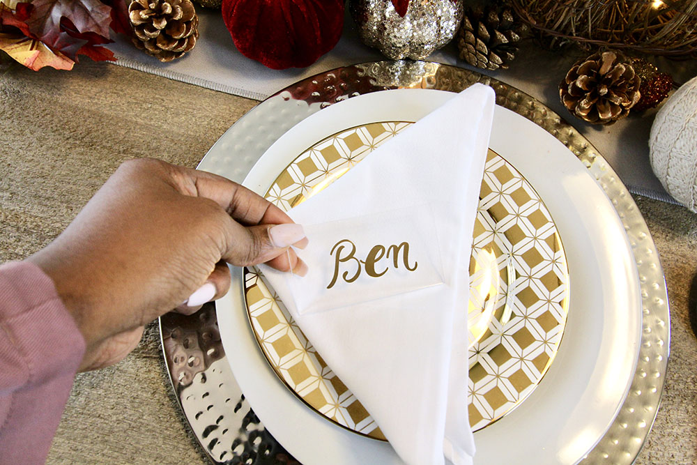 A personalized napkin on a place setting.