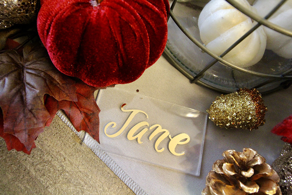 A personalized name card on a dining table. A personalized name card on a dining table.
