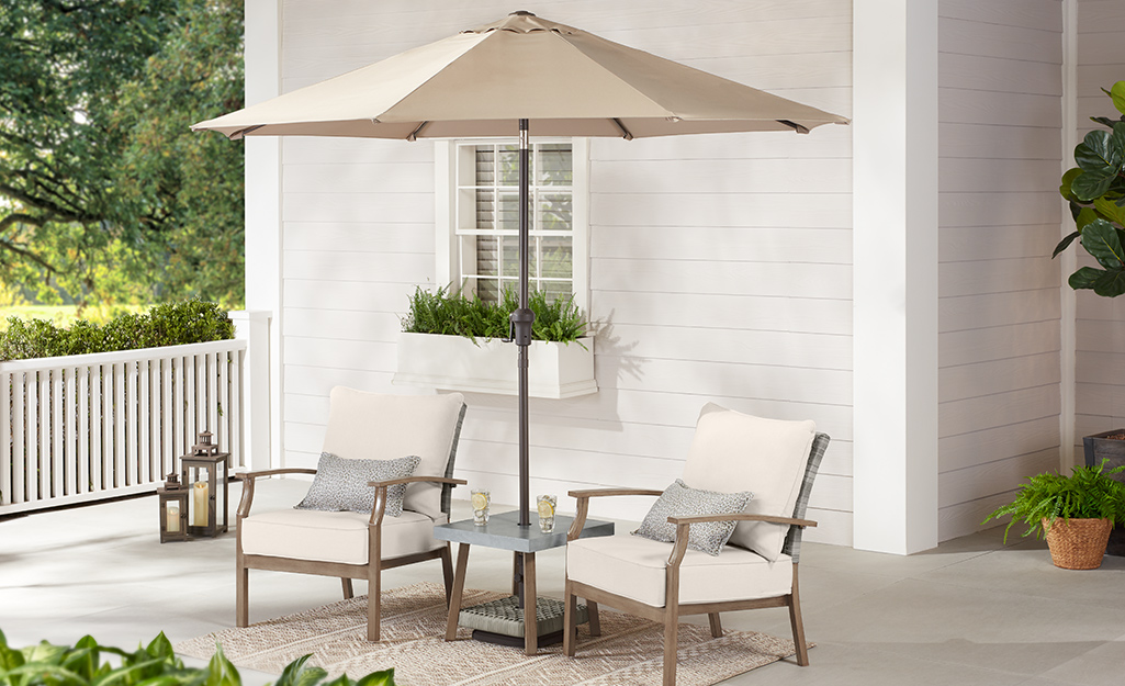 A patio table with an umbrella shade.