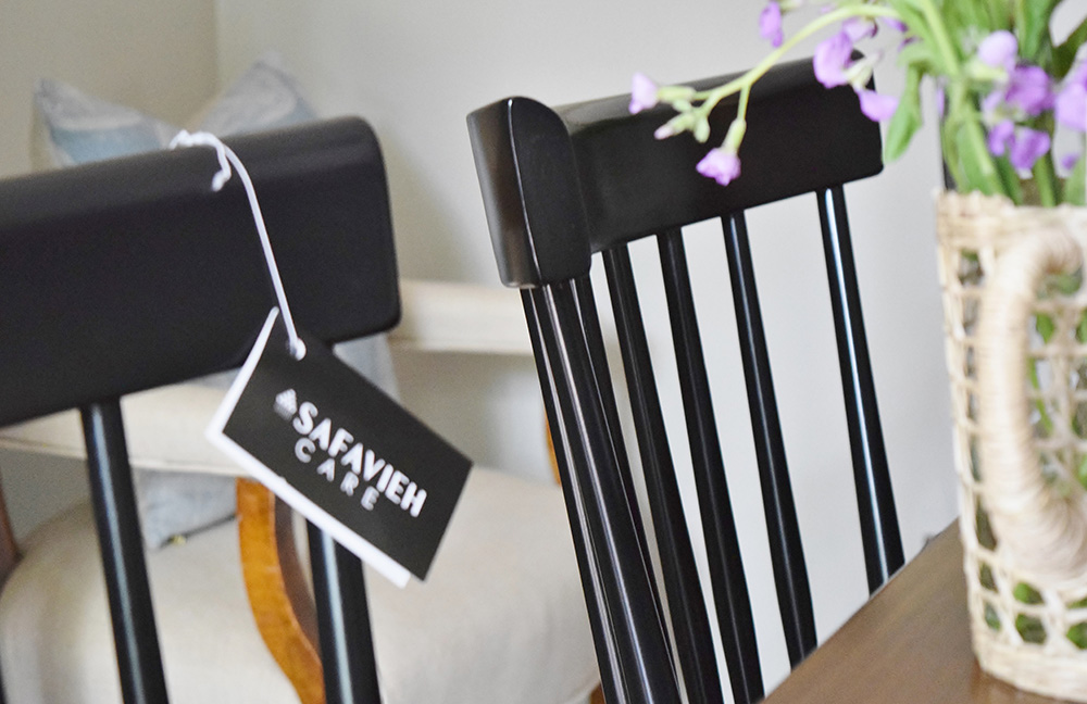 Black dining room chair with tag