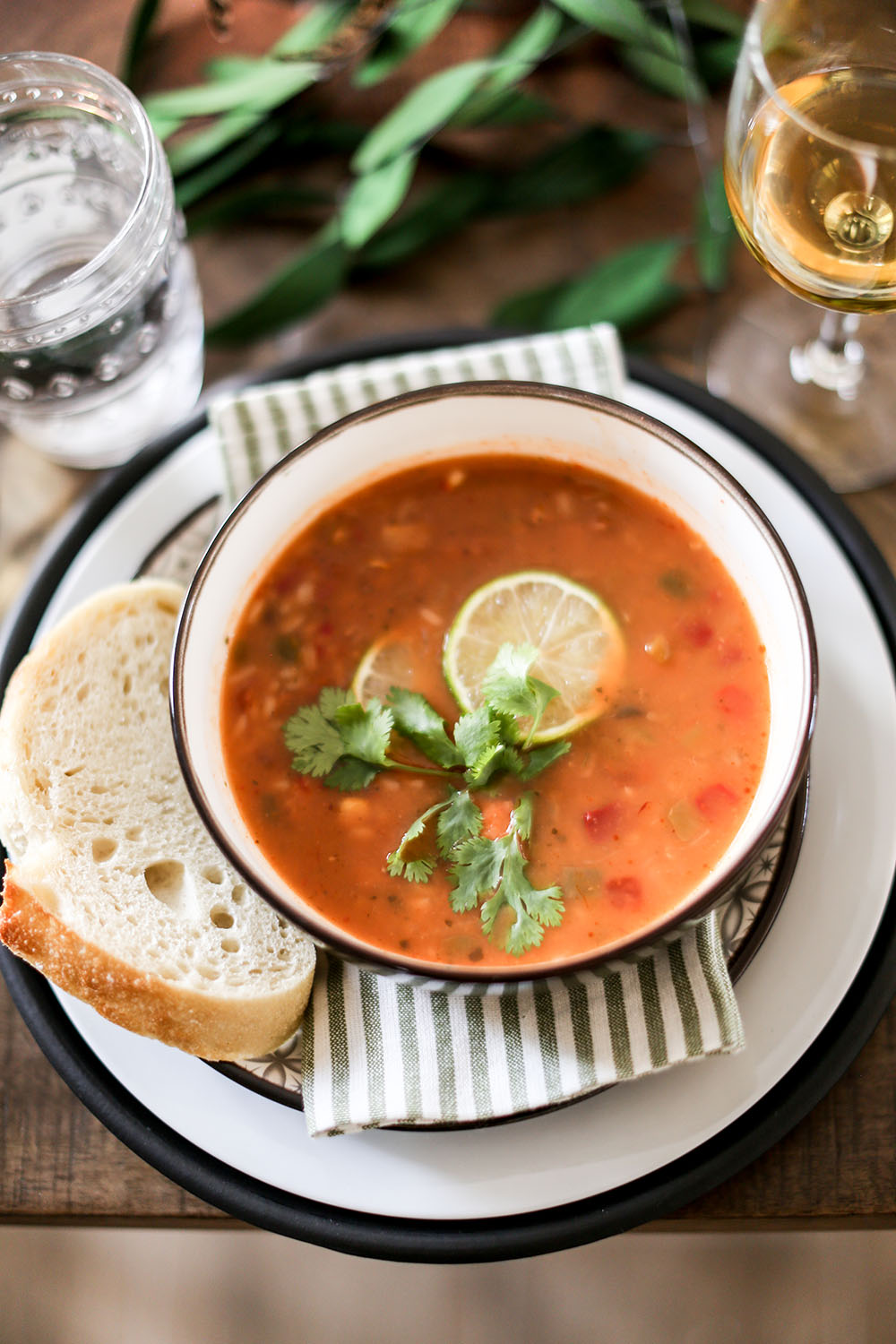 A bowl of soup with bread. A bowl of soup with bread.