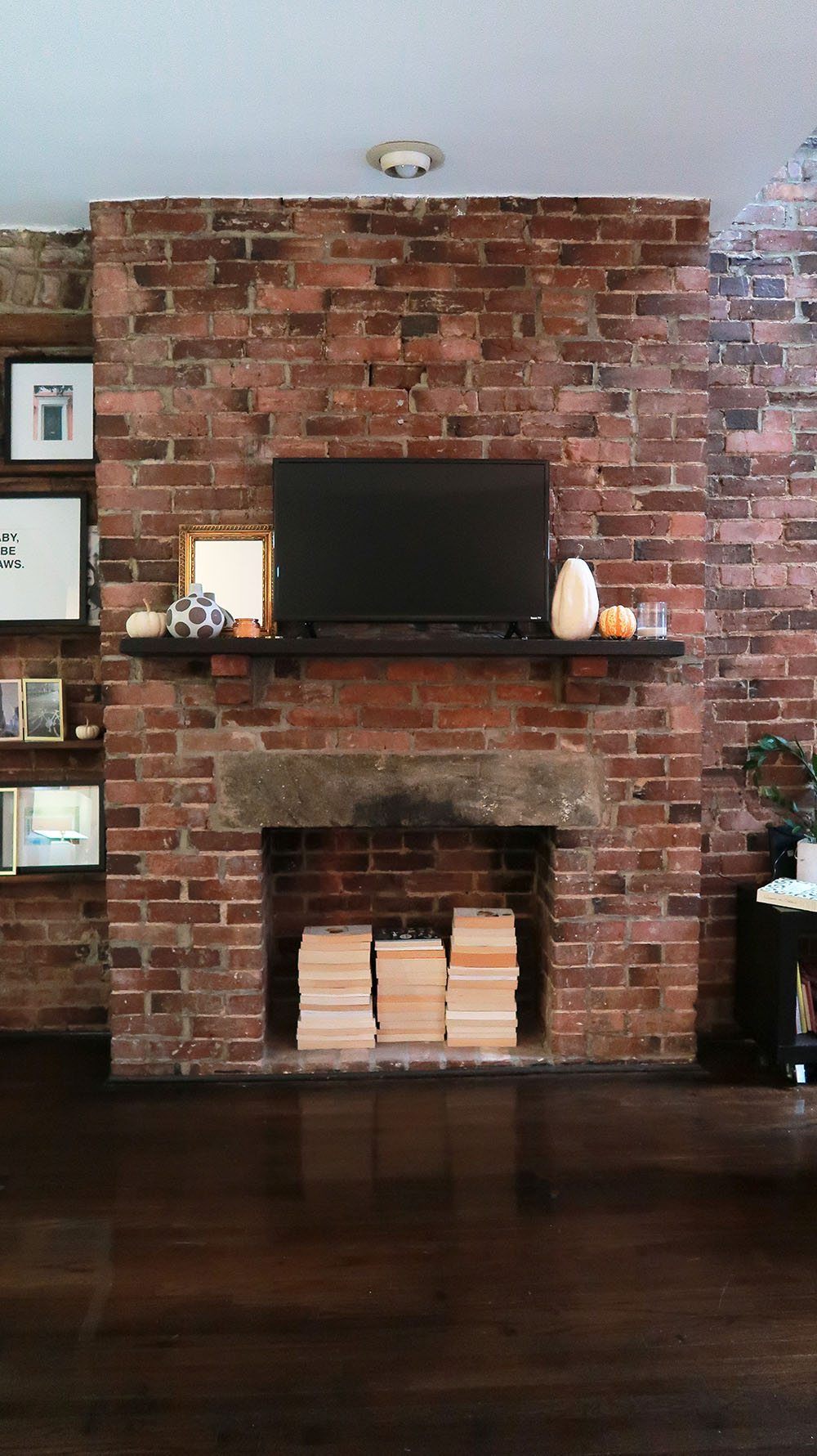 living room with brick fireplace