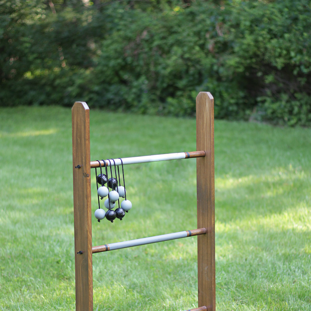 A DIY ladder golf game displayed in a yard.
