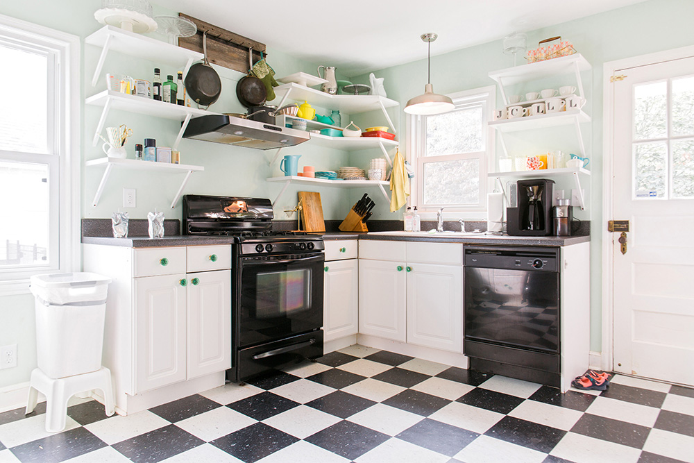 Remodeled Kitchen Room With Cream Cabinets, Black Appliances And White  Walls. Northwest, USA Stock Photo, Picture and Royalty Free Image. Image  97021825.