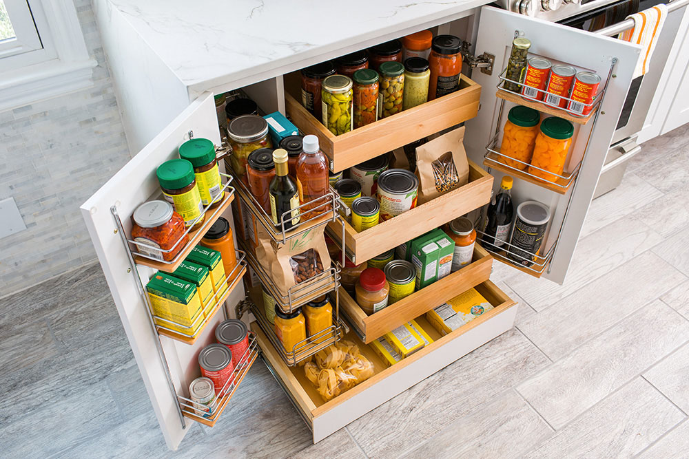 A kitchen cabinet with additional storage for spices and other items. 
