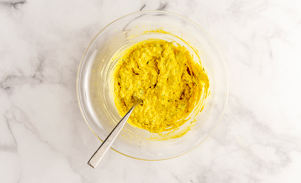 A bowl of deviled egg mixture on a table. A bowl of deviled egg mixture on a table.