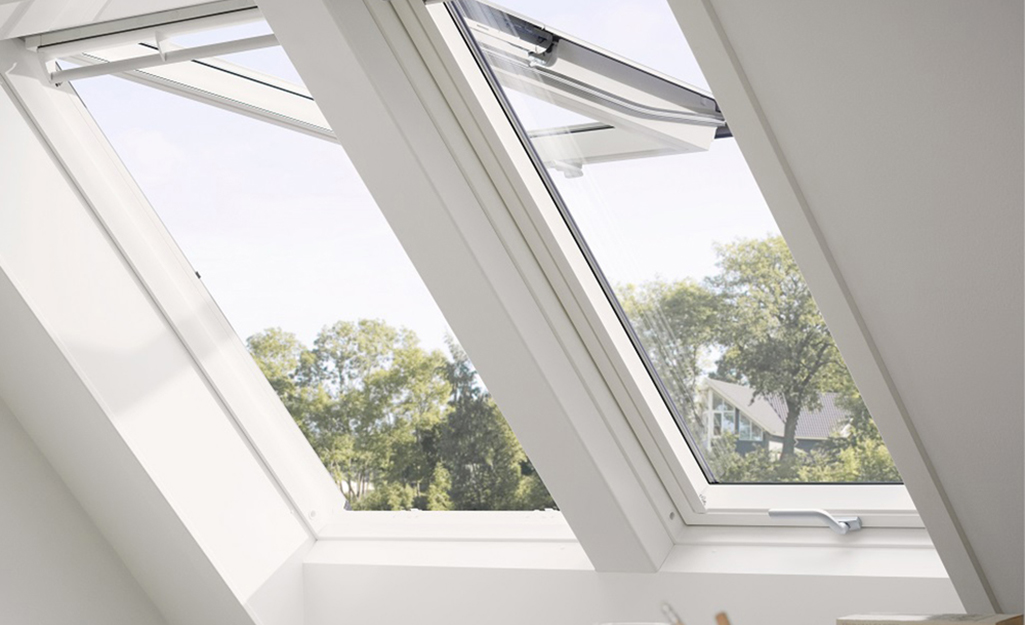An awning style egress window swings open from the top.