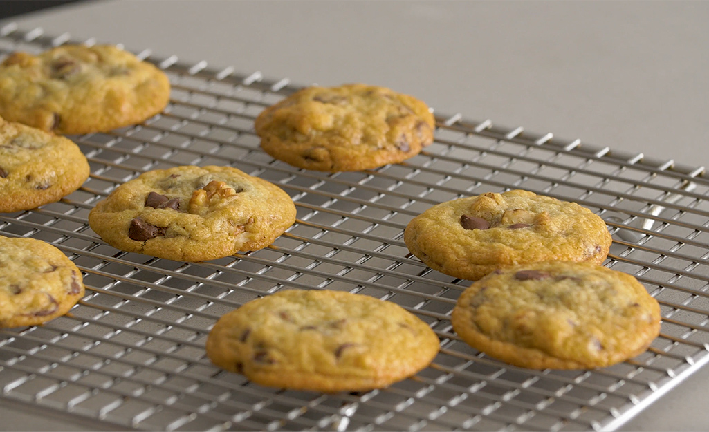Chocolate chip cookies sitting on a cooling rack