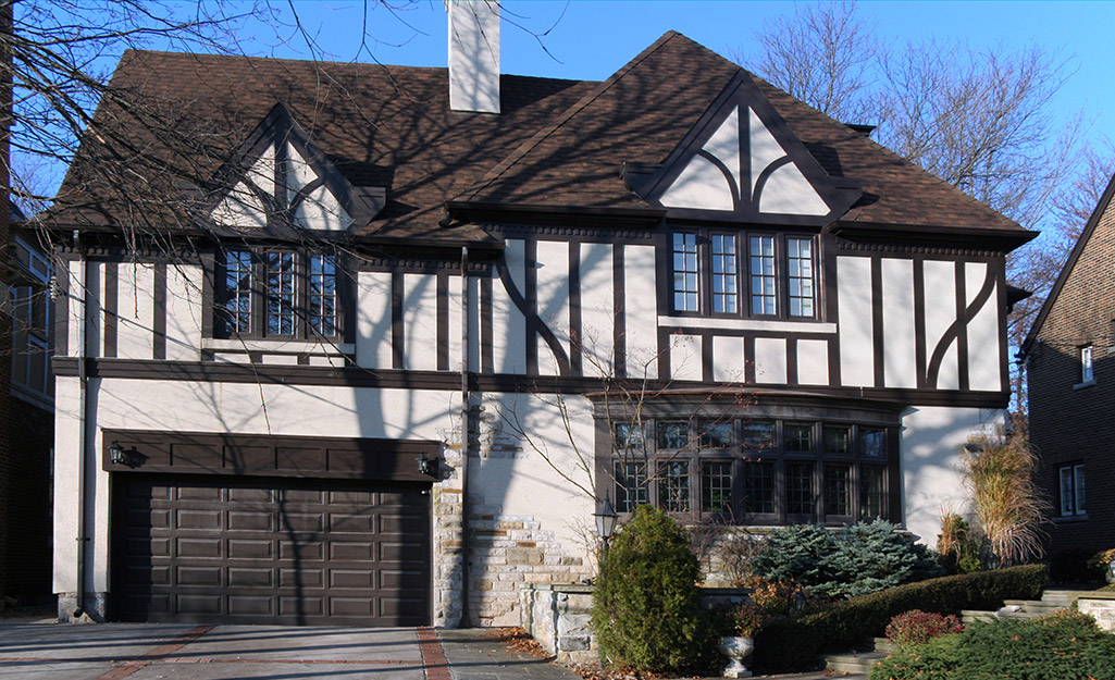 A Tudor house features a classic brown and cream exterior.