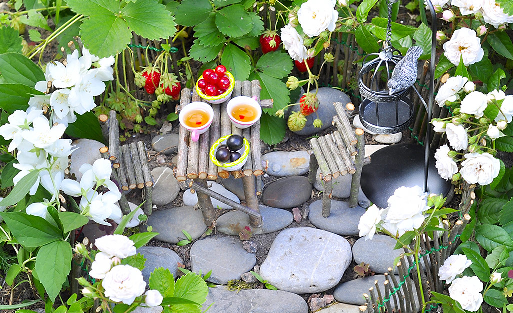 A fairy garden with a tiny table.