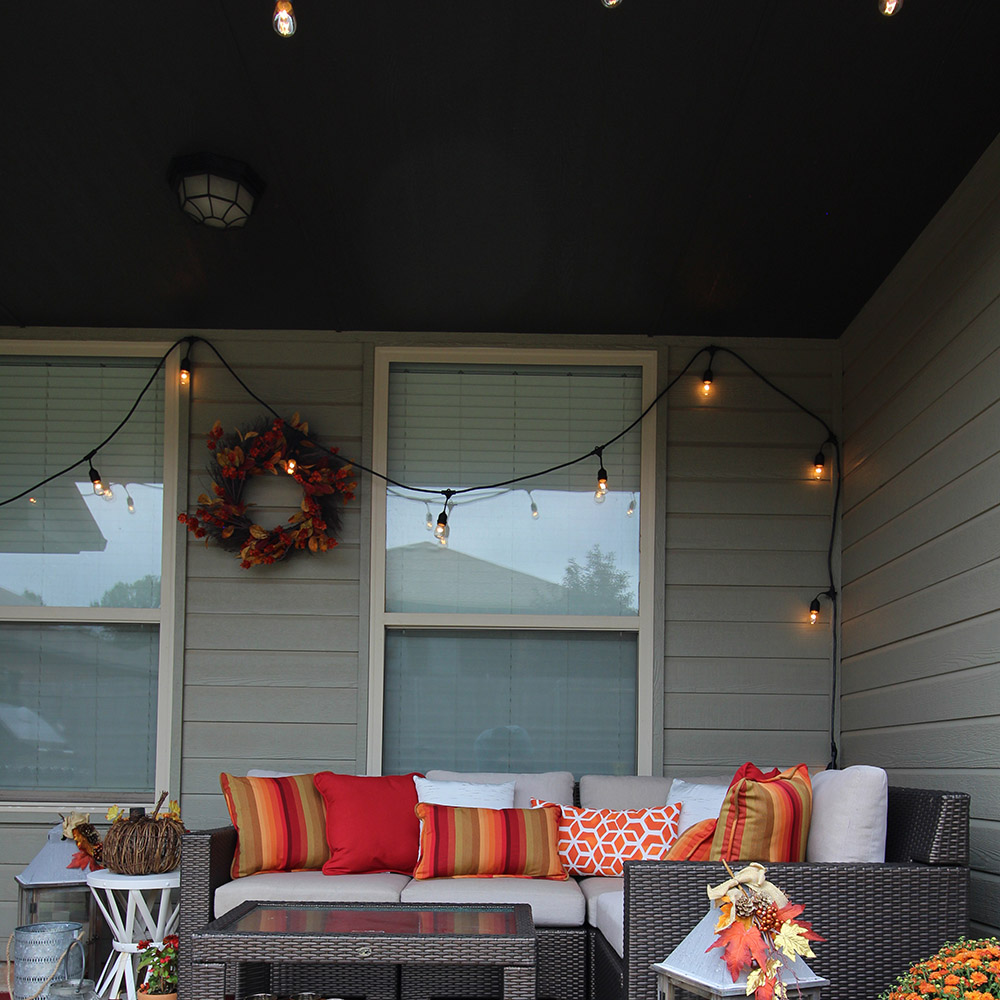 A patio decorated in red, orange, and yellow for Fall.