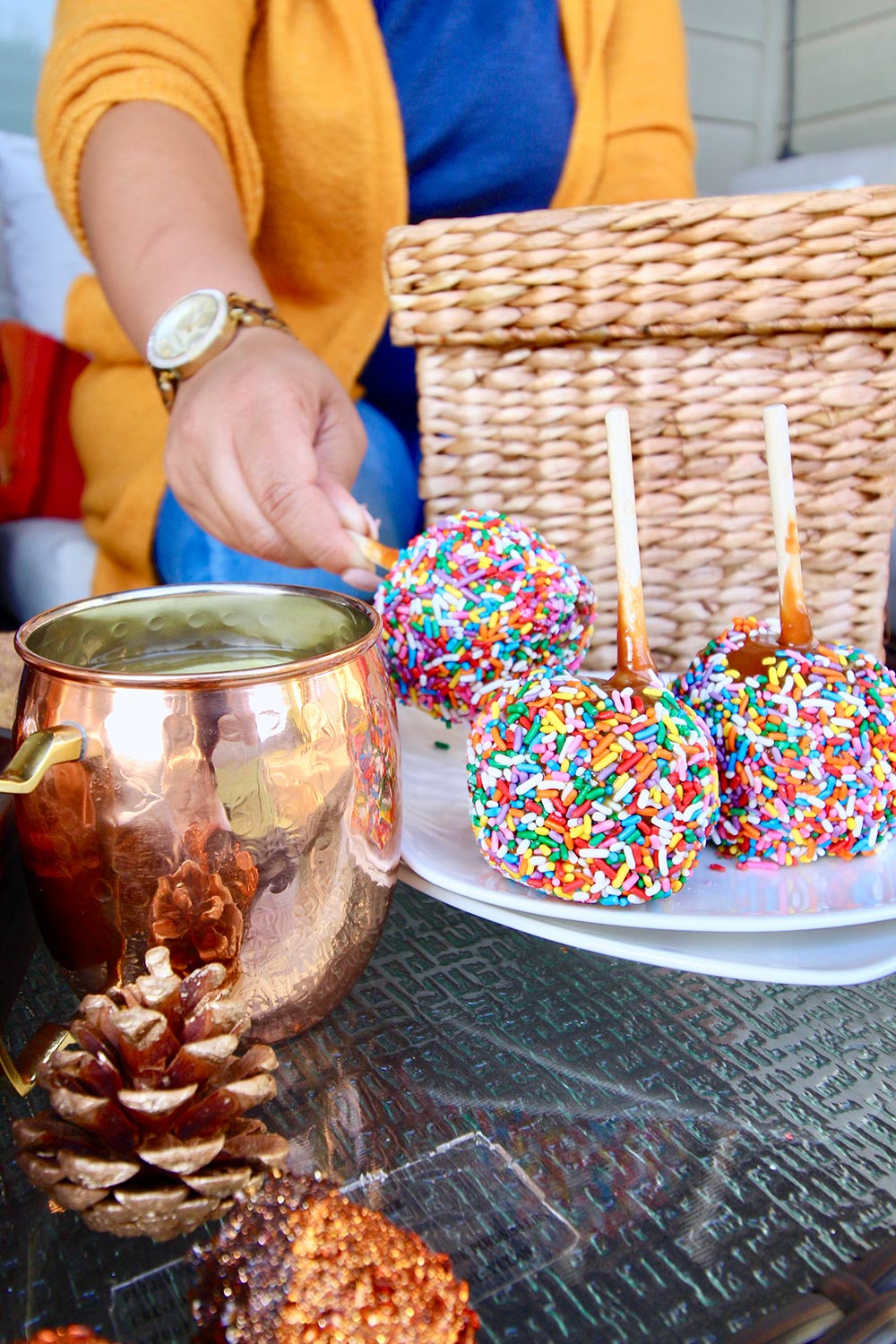 A plateful of candy dipped apples.