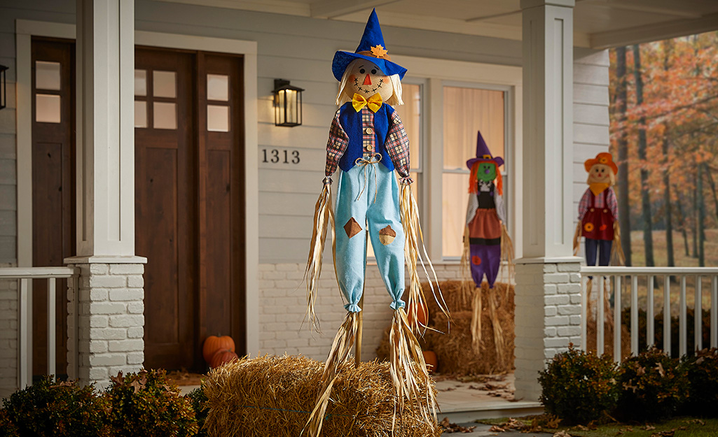 Fall porch decor displayed on a porch.