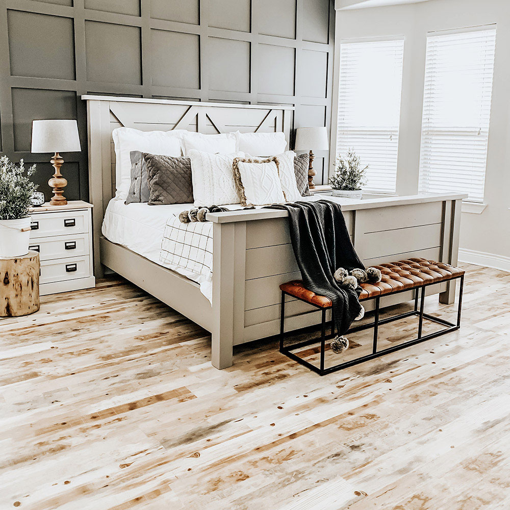 A master bedroom with Lifeproof sheet vinyl flooring.