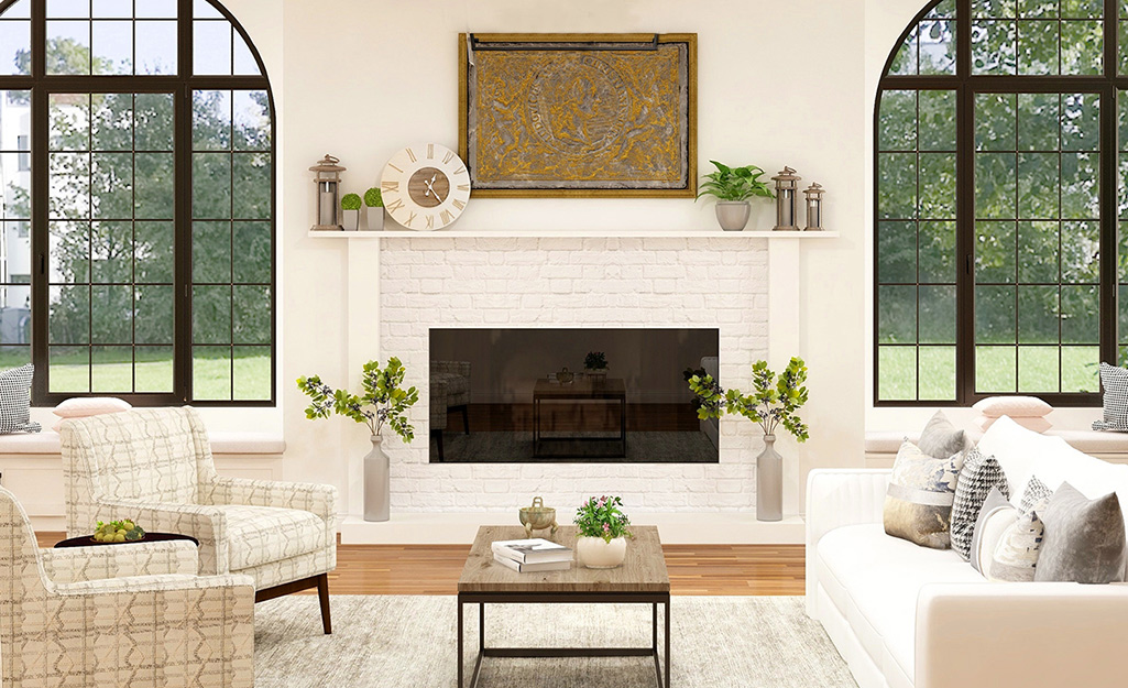 A white living room with white fireplace topped with a white mantel 