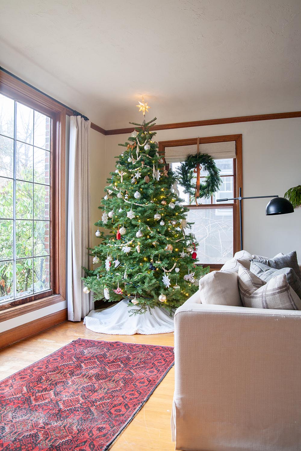 A Christmas tree in living room window 