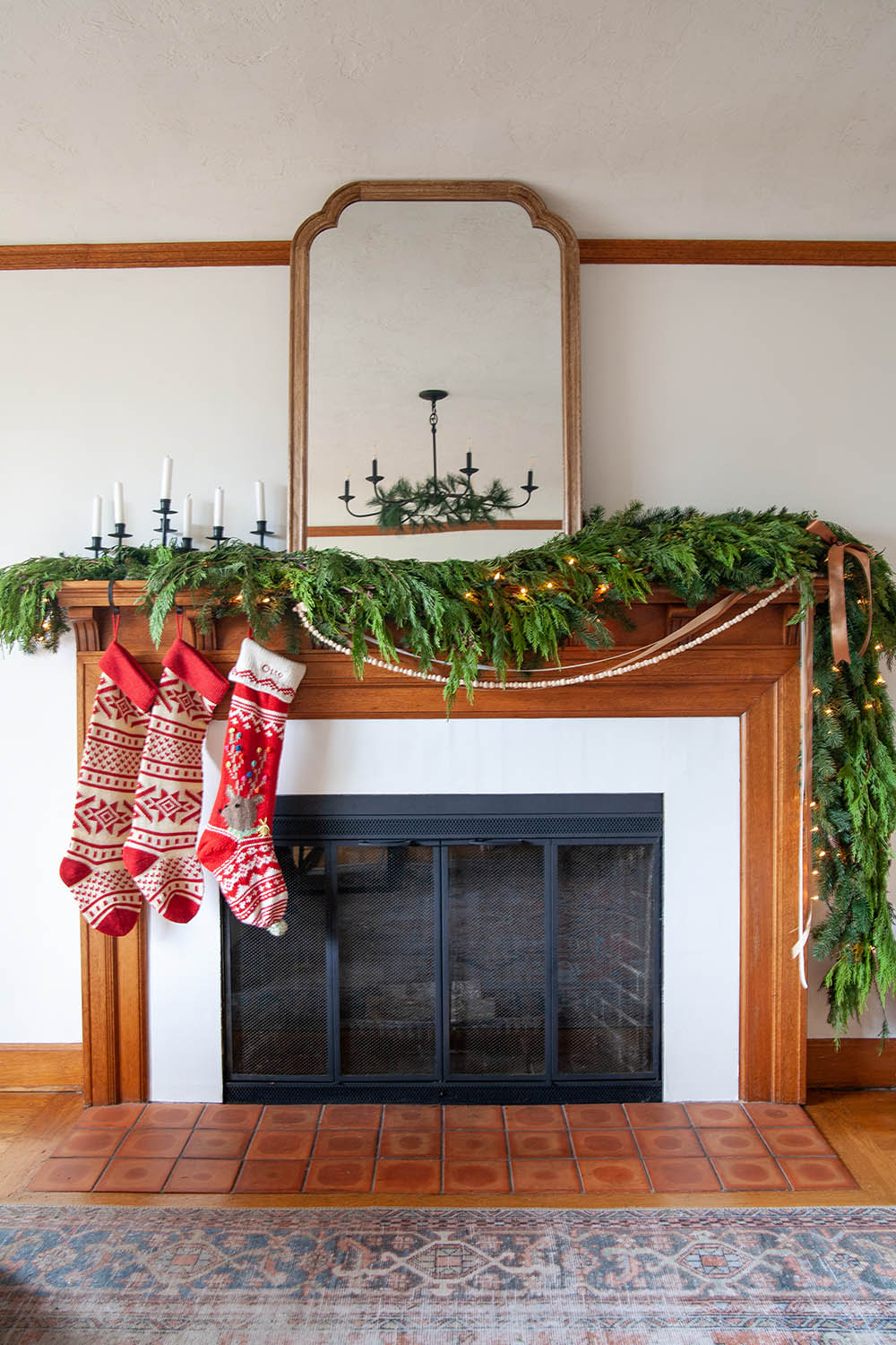 Fireplace with greenery and stockings 