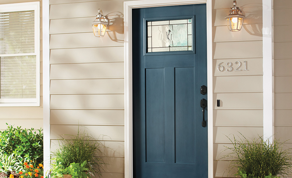 A home exterior featuring a craftsman style front door.