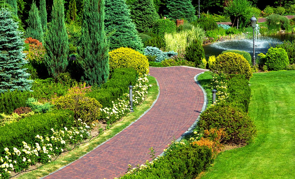 A brick walkway garden path.