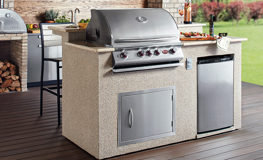 A built-in gas grill is part of an outdoor kitchen.