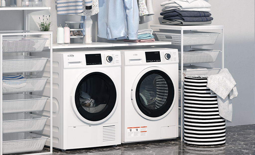 A white washer and matching dryer sit next to each other in a laundry room.