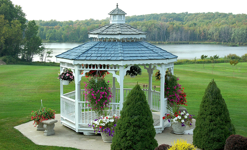 A white gazebo with a cupola.