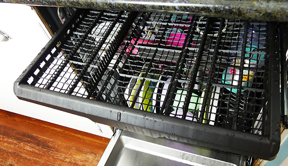 A dishwasher with an extended third rack.