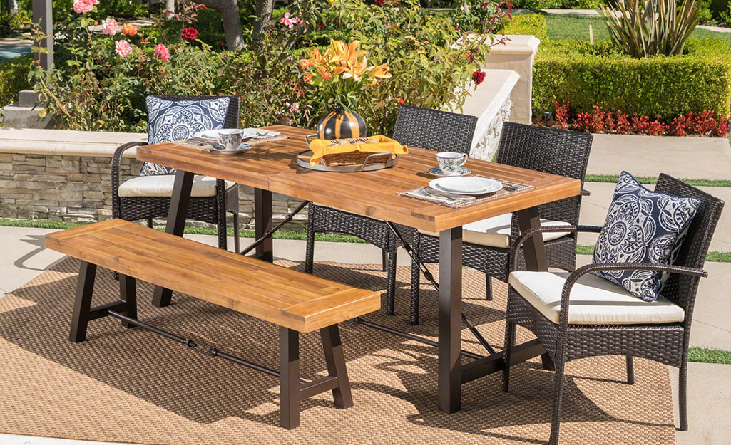 A patio set with a bench seat.
