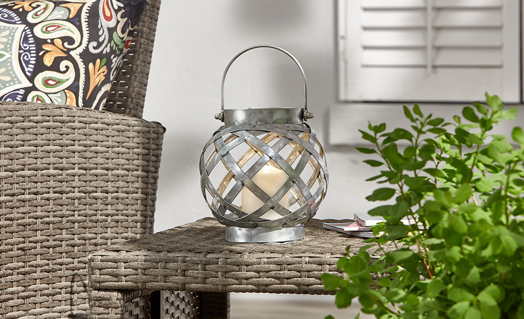 An outdoor lantern on a patio side table.
