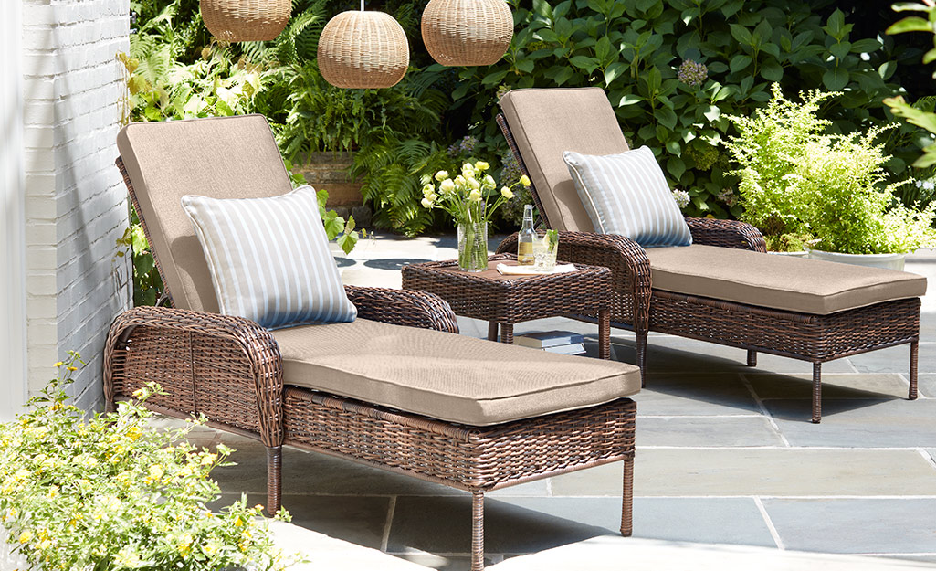 Two outdoor lounge chaise chairs.
