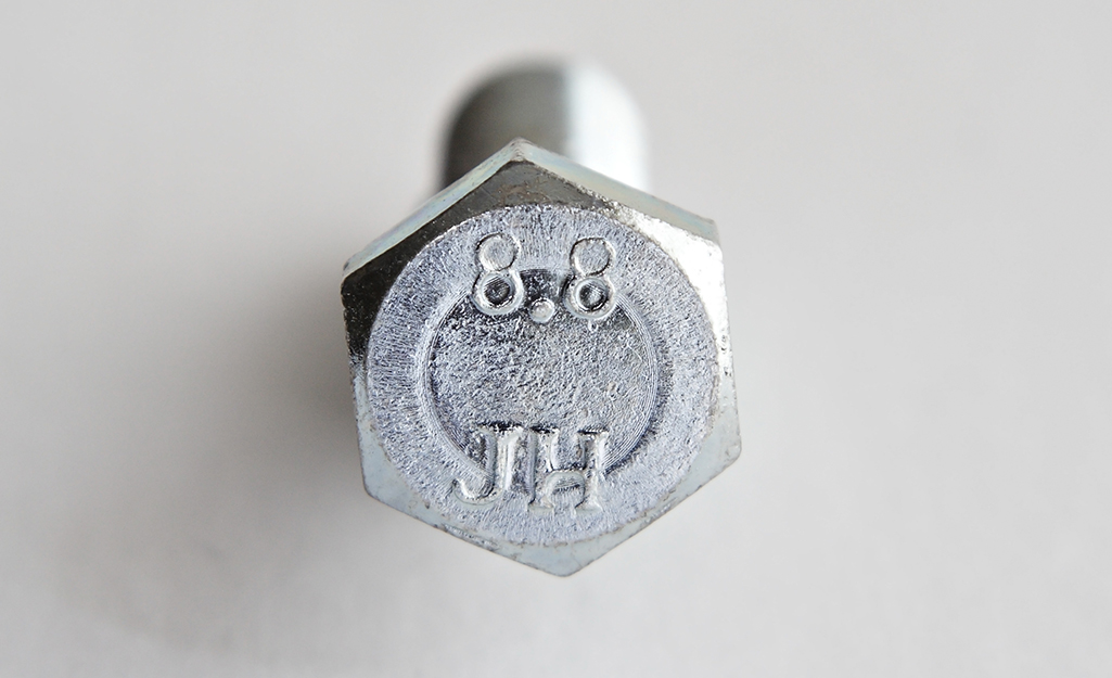A metric class 8.8 bolt on a white background.