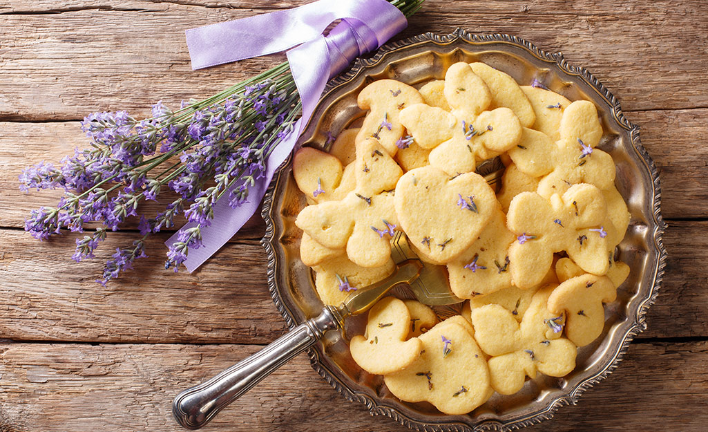 A lavender bouquet next to lavender shortbread.