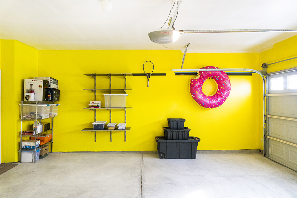 Closed garage with items organized on wall shelves
