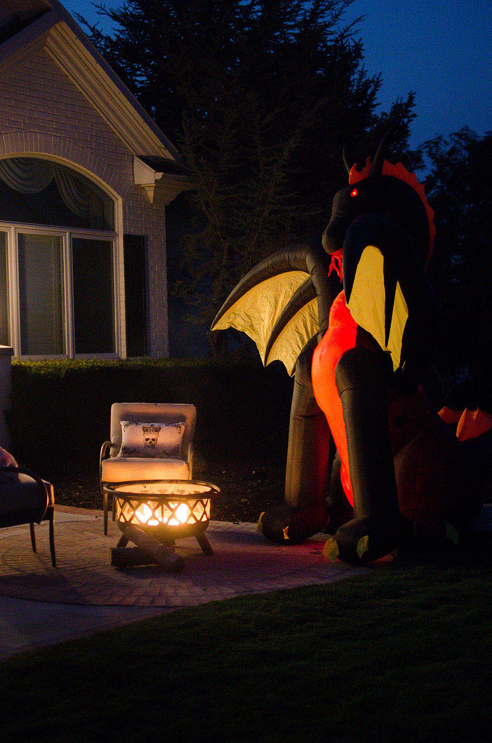 Inflatable dragon next to fire pit Inflatable dragon next to fire pit