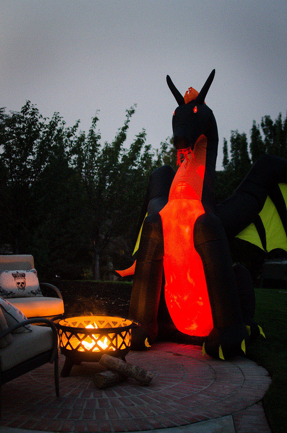 Inflatable dragon next to fire pit Inflatable dragon next to fire pit