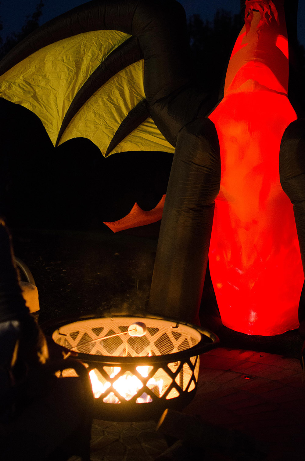 Inflatable dragon next to fire pit Inflatable dragon next to fire pit