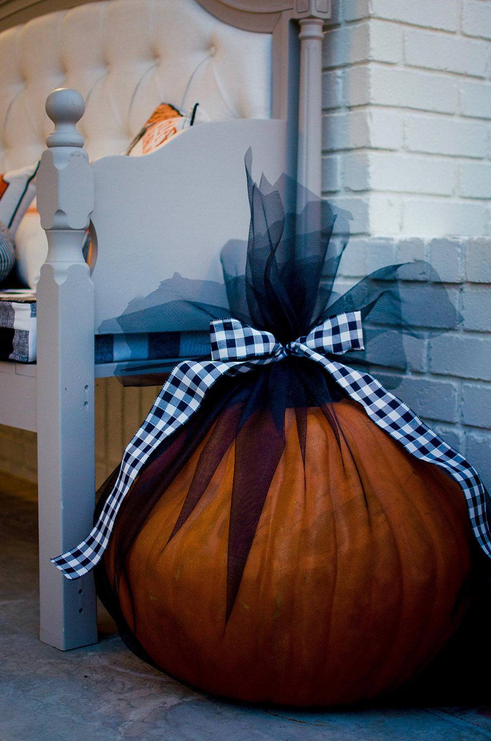 Pumpkin wrapped in black mesh as outside decor Pumpkin wrapped in black mesh as outside decor