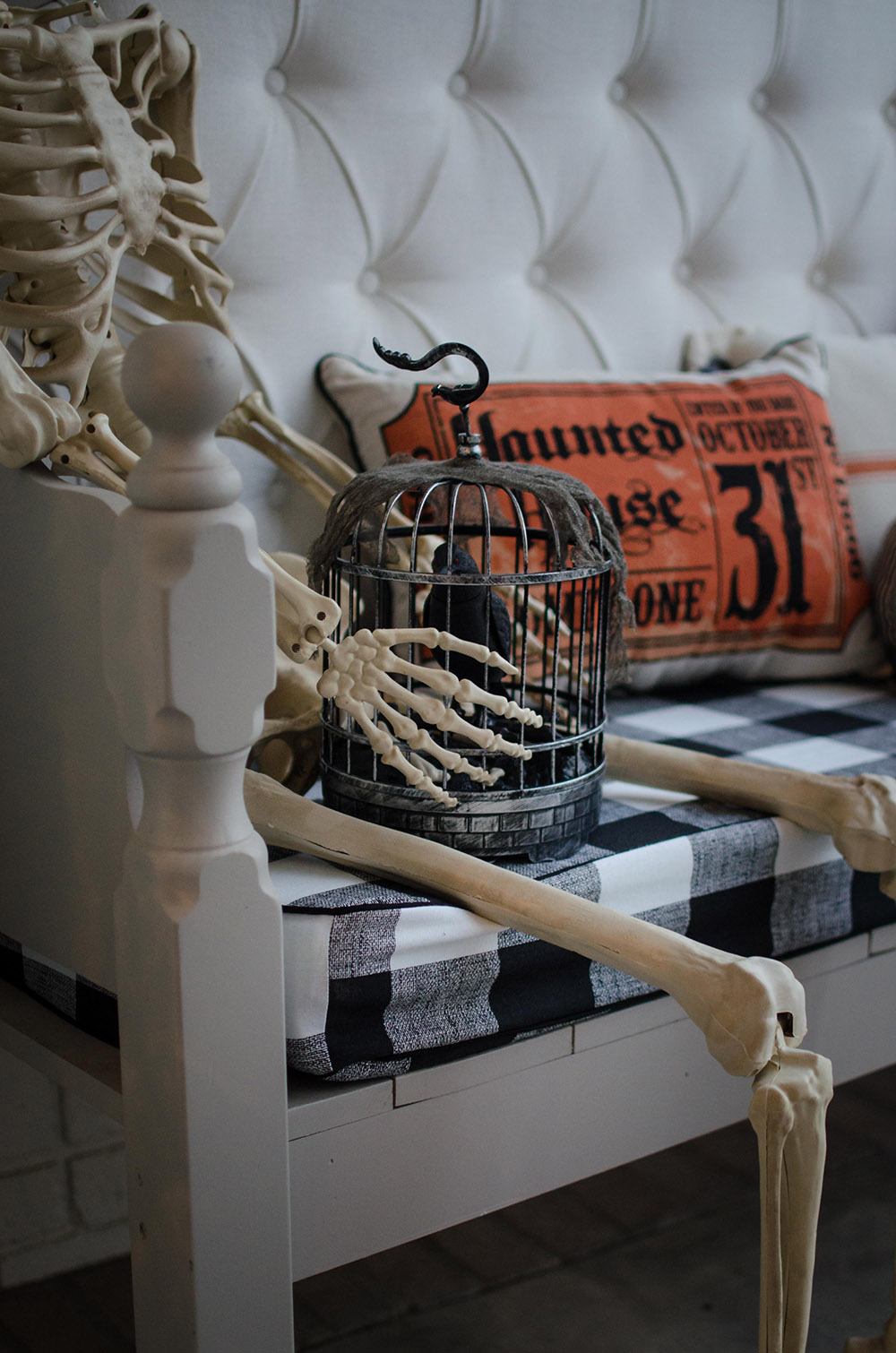 Skeleton sitting on front porch bench Skeleton sitting on front porch bench