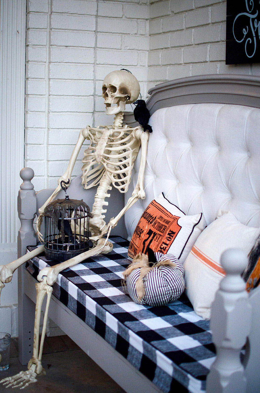 Skeleton sitting on front porch bench Skeleton sitting on front porch bench