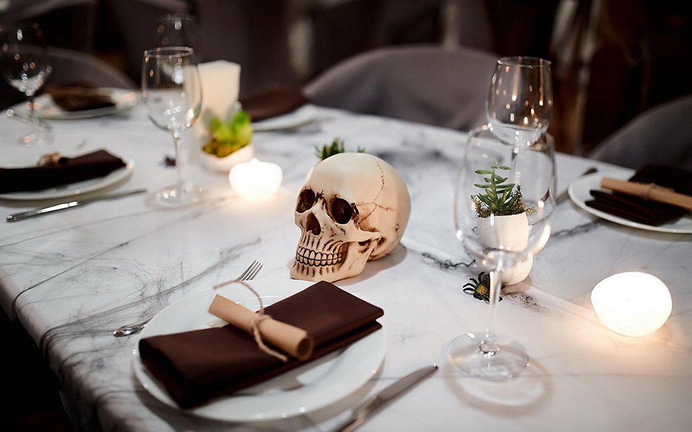 A table with a skull centerpiece.