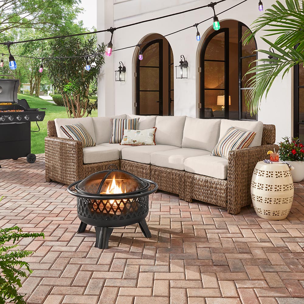 A patio outfitted with a Hampton Bay patio furniture set.