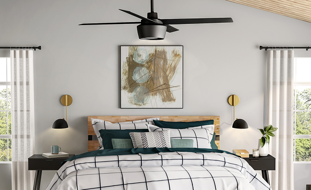 A bedroom with a Hampton Bay ceiling fan.