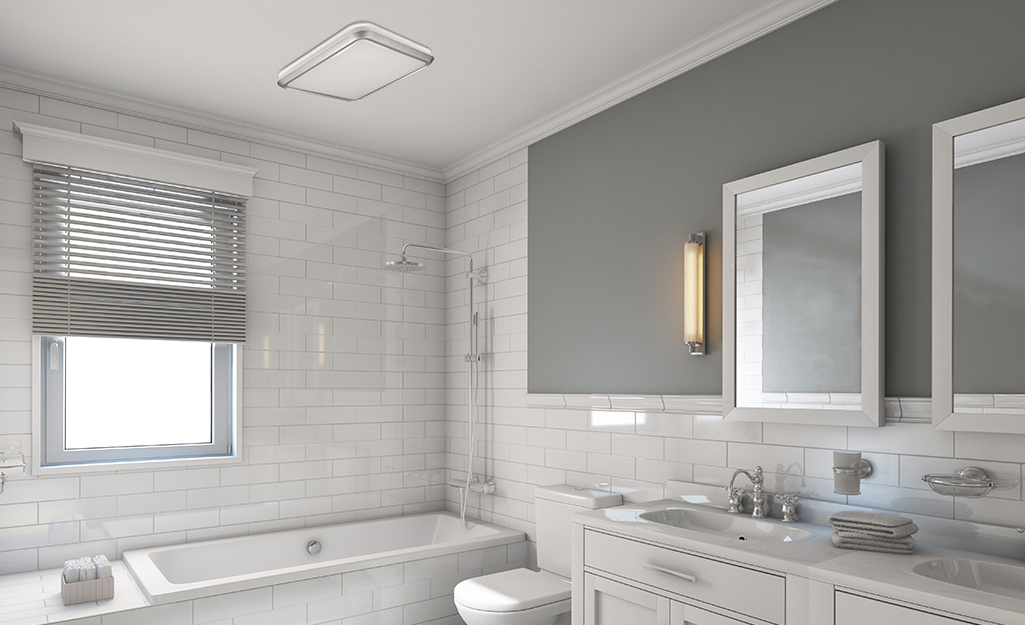 A bathroom with a Hampton Bay bath fan in the ceiling.