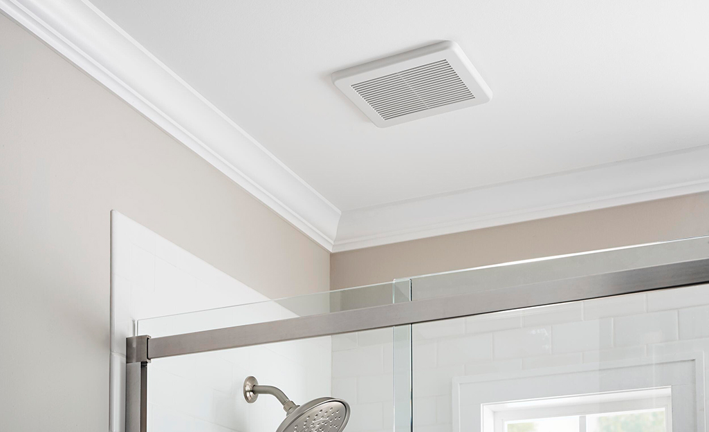 A Hampton Bay bath fan installed in a ceiling.