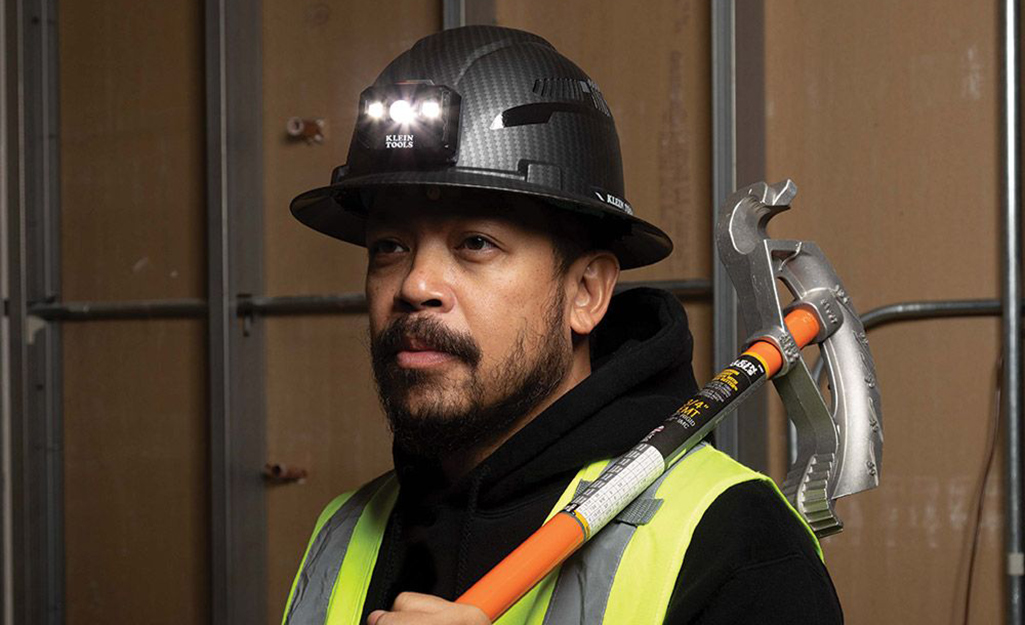 A man with a black hard hat on.