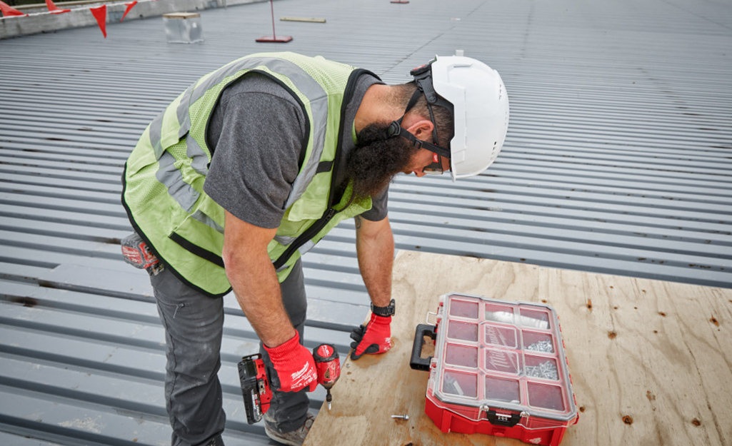 A man with a white hard hat on